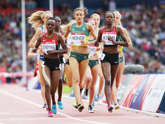 Kenya's Purity Cherotich Kirui (right) along with Milcah Chemos Checywa (left) and Australia's Madeline Heiner (centre) lead the Women's 3000m steeplechase going into the last lap at Hampden Park Stadium during the Commonwealth Games 2014 in Glasgow, S