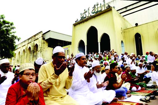 Thousands offering Munajat seeking divine blessings of Allah after Eid-ul-Fitr Namaj at city's Baitul Mukarram Nat'l Mosque on Tuesday.