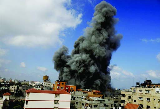 Smoke rises after an Israeli strike hit the offices of the Hamas movement's Al-Aqsa satellite TV station, in Gaza City, northern Gaza Strip on Thursday.