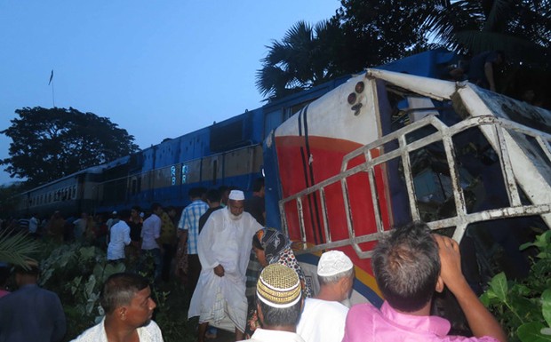 At least ten passengers of a bus have died when a train crashed into it at a railway crossing at Jhenaidah's Kaligram early on Friday.