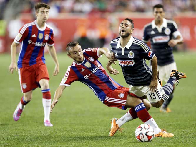 Bayern Munich's Rafinha (left) fouls Chivas' Sergio Napoles during the second half of an international friendly soccer match at Red Bull Arena, in Harrison, N.J on Thursday. Bayern Munich won 1-0.