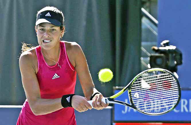 Ana Ivanovic, of Serbia, returns the ball during the second set of her match against Carol Zhao in the Bank of the West Classic tennis tournament in Stanford, Calif., Thursday, July 31, 2014. Ivanovic won 6-1, 6-1.