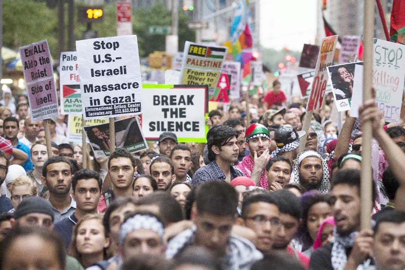 Demonstrators gather on Sixth Avenue outside News Corporation for a protest against Israeli military operations in the Gaza Strip on Friday.