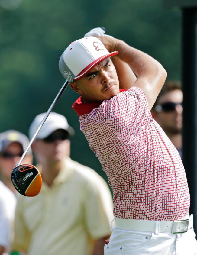 Rickie Fowler watches his tee shot on the 11th hole during the second round of the Bridgestone Invitational golf tournament at Firestone Country Club in Akron, Ohio on Friday.