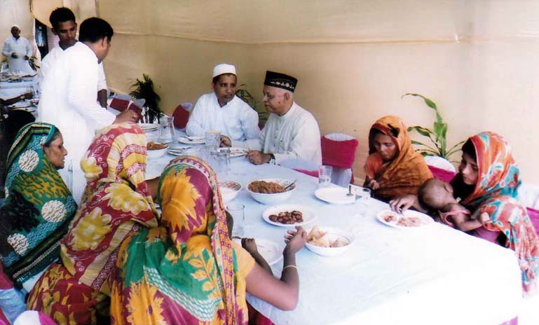 CCC Mayor M Mozoor Alam exchanging Eid greetings with distressed women in Chittagong yesterday.