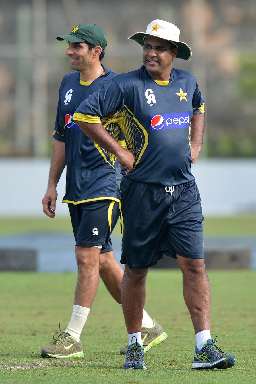 Pakistan cricket team captain Misbah-ul-Haq (L) and coach Waqar Younis walk during a practice session at the Galle International Cricket Stadium in Galle on Sunday. Pakistan and Sri Lanka play a two-Test series starting in Galle from tomorrow (August 6).