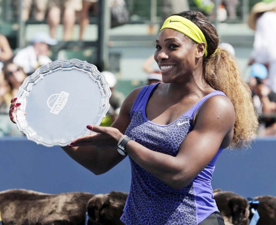 Serena Williams holds the winner's trophy after beating Angelique Kerber of Germany, during the championship match of the Bank of the West Classic tennis tournament on Sunday in Stanford Calif. Williams won the match 7-6 (1), 6-3.