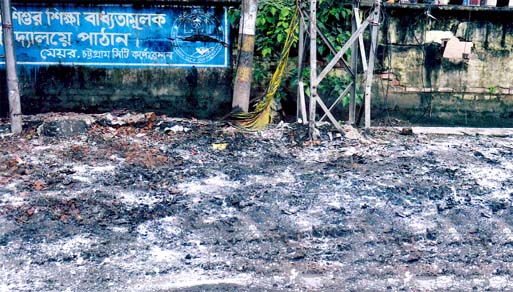 Open space in front of Baddarhat Eklasur Rahman Primary School has turned into a dumping place causing sufferings to the students.