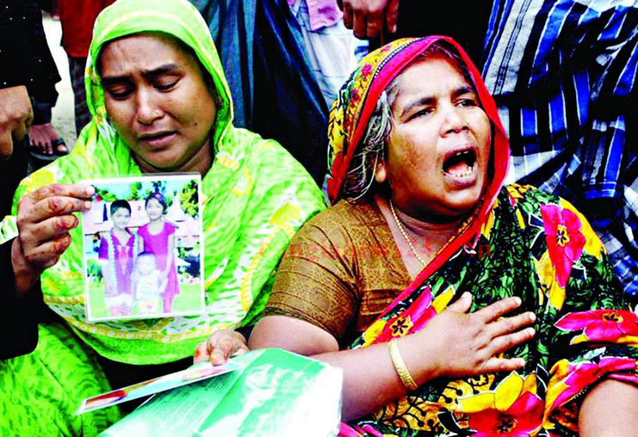 Relatives wailing for their near and dear ones missing in launch capsized near Mawa Ghat on Monday. This photo was taken on Tuesday.