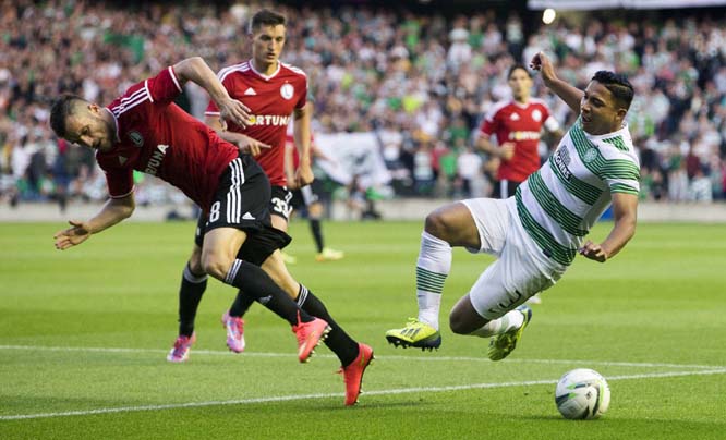 Celtic's Emilio Izaguirre (right) and Legia Warsaw's Lukasz Broz battle for the ball during their Champions League qualifying soccer match at Murrayfield, Edinburgh on Wednesday.