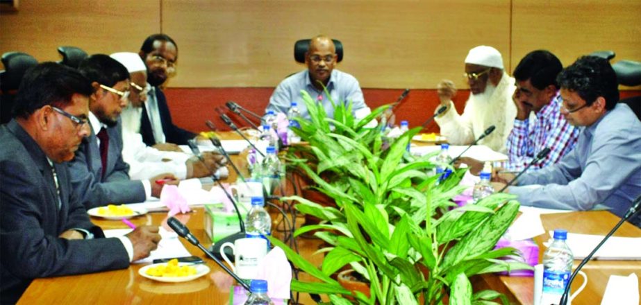Abdus Samad, Chairman of the Executive Committee of Al-Arafah Islami Bank Limited presiding over the 449th Board meeting at its board room on Thursday.
