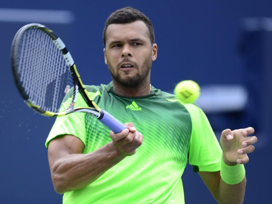 Jo-Wilfried Tsonga of France makes a return to Andy Murray of Great Britain at the Rogers Cup tennis tournament in Toronto on Friday.