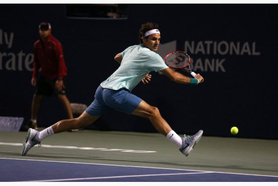Roger Federer chases down a ball for a return on his way to a straight-sets win over Spaniard Feliciano Lopez in semifinal action at the Rogers Cup on Saturday.