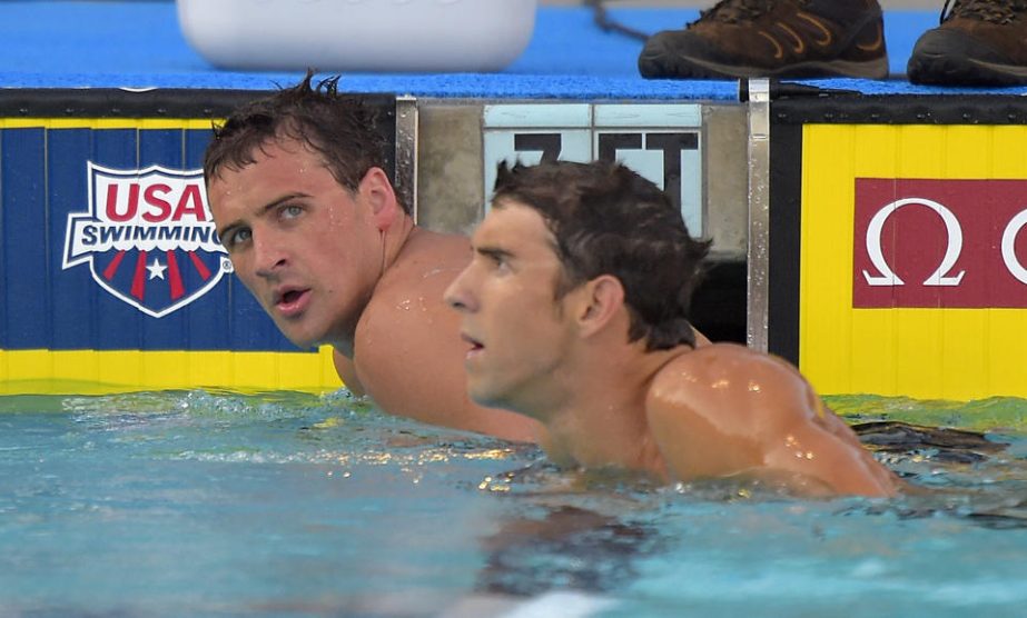 Ryan Lockte (left) and Michael Phelps look on after the men's 200-meter individual medley final at the US nationals of swimming in Irvine, Calif on Sunday.