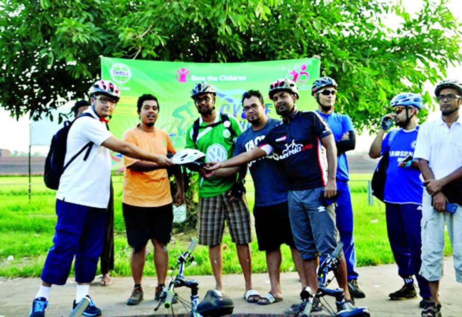 Dettol, a brand of Reckitt Benckiser Bangladesh Ltd, initiates cycling for collecting funds for "Cycle the World for Save the Children" recently. Mahbub Baset, Marketing Director, Reckitt Benckiser Bangladesh & Sri Lanka and Hossain Mohammad Sarram, Man