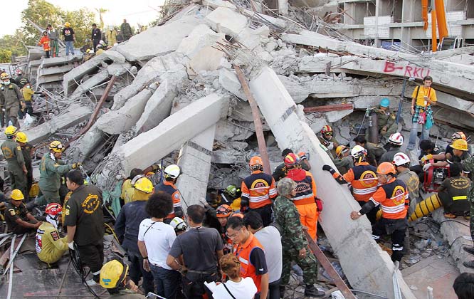 Thai rescue workers and soldiers continue their search at the site of a six-story building collapse in Pathum Thani province, just north of Bangkok, Thailand.