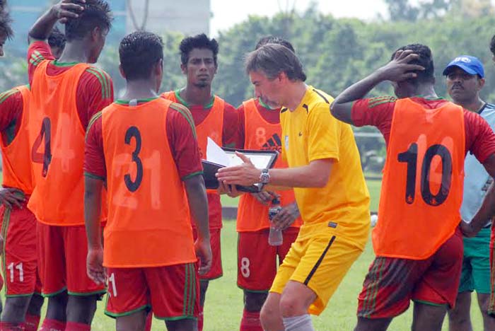 Head Coach of Bangladesh National Football team Lodewijk Darius De Kruif giving instructions to the players of Bangladesh National Under-23 Football team at the BKSP Ground in Savar on Tuesday.