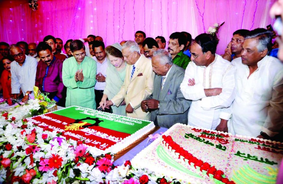 BNP Chairperson Begum Khaleda Zia cutting cake on her birthday at her Gulshan office in the city on the first hours of Friday. Party leaders and activists were present on the occasion.