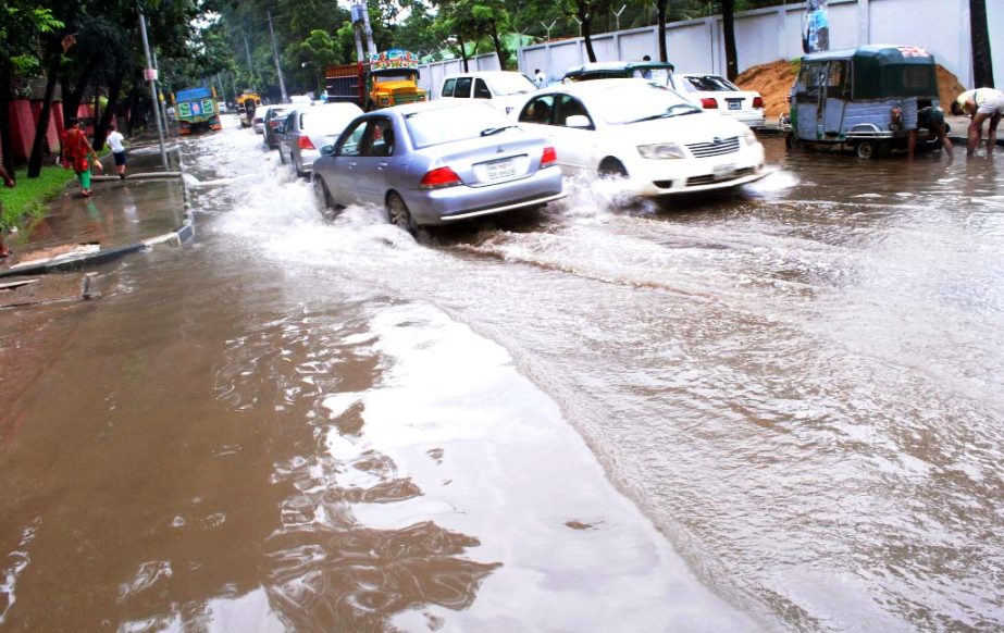 Vehicles struggle through the stagnated rain water. The snap was taken from the city's Mintoo road on Friday.