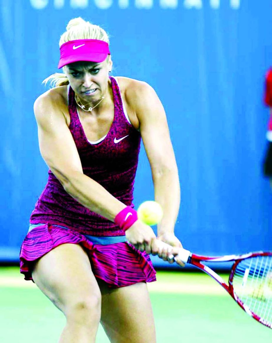 Sabine Lisicki from Germany hits a backhand to Agniezka Radwanska from Poland during a match at the Western & Southern Open tennis tournament in Mason, Ohio on Thursday.