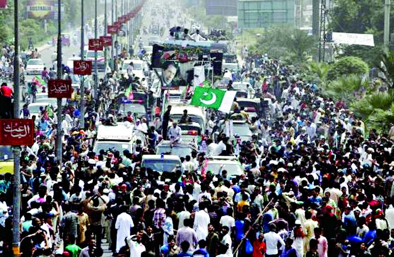 Supporters of cricketer-turned-opposition politician Imran Khan take part in the Freedom March in Gujranwala on Friday.