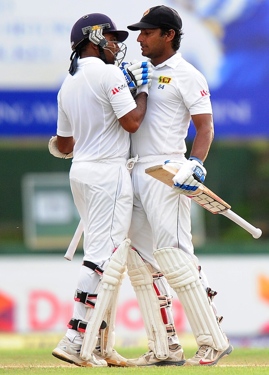 Kumar Sangakkara (left) is congratulated by Mahela Jayawardene after his fifty on the 3rd day of 2nd Test between Sri Lanka and Pakistan in Colombo on Saturday.