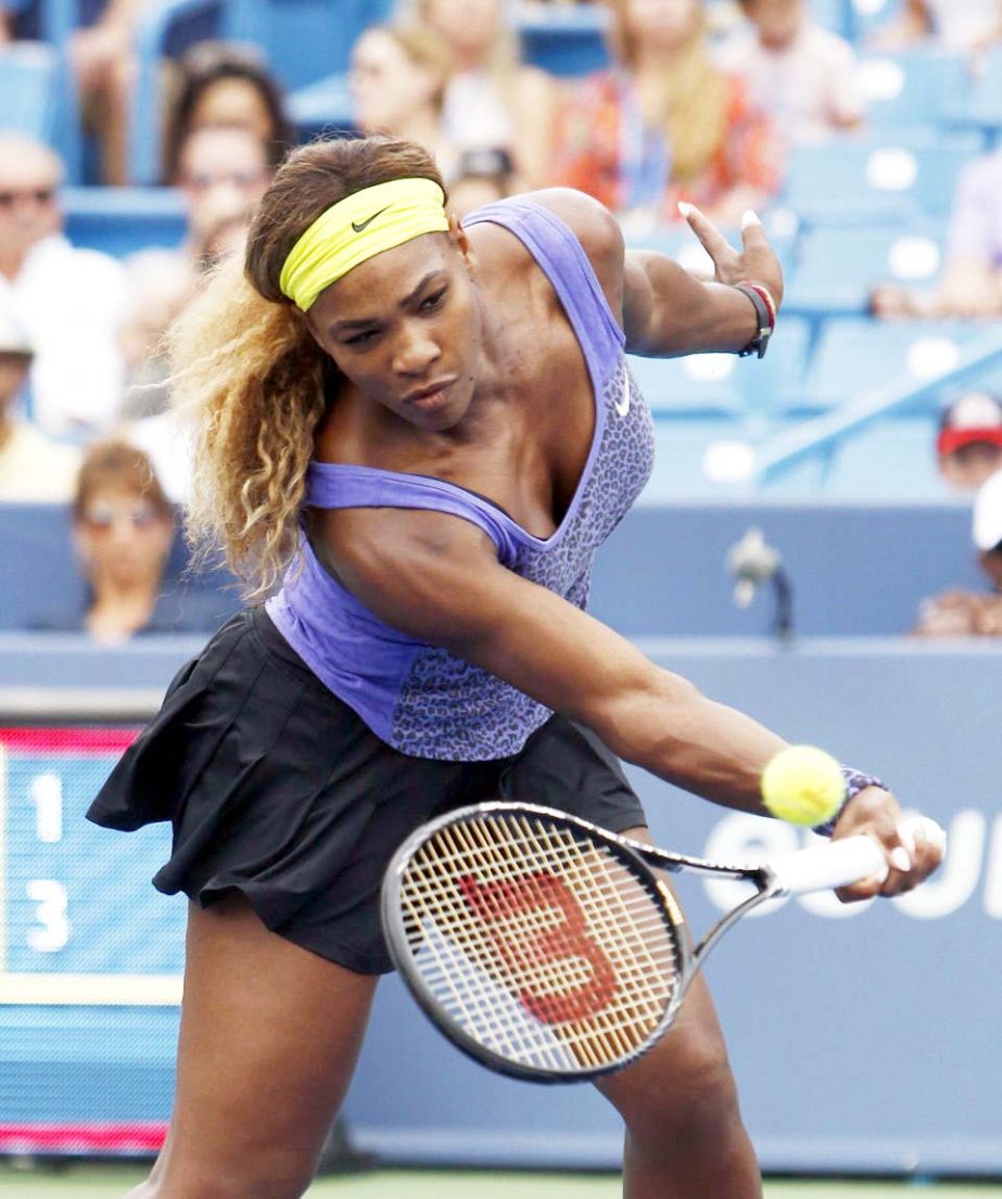 Serena Williams returns a volley to Caroline Wozniacki from Denmark, during a semifinal match at the Western & Southern Open tennis tournament in Mason, Ohio on Saturday.