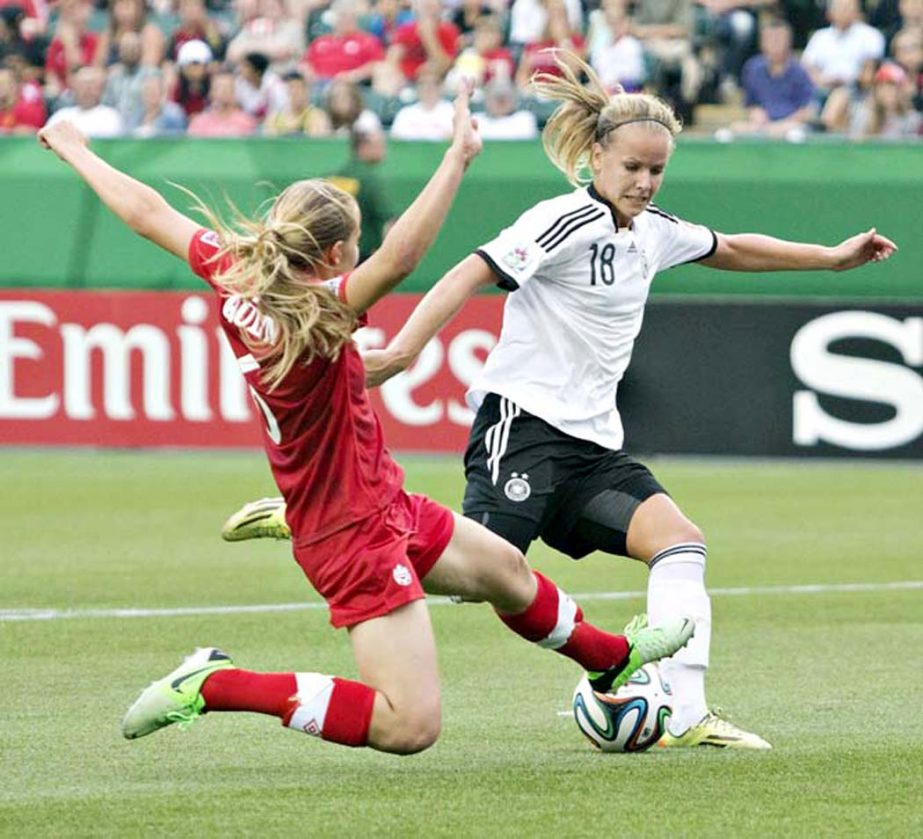 Canada's Rebecca Quinn (6) defends Germany's Lena Petermann (18) during the first half of a U-20 women's World Cup soccer quarterfinal in Edmonton, Alberta on Saturday.