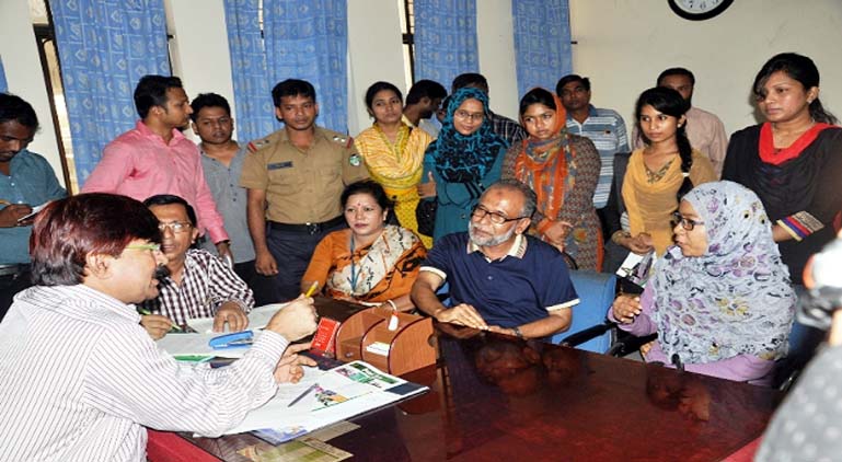 Chief Commercial Manager of Railway East Zone Md. Belaluddin answering to queries of passengers during mass hearing at Chittagong Railway station yesterday.