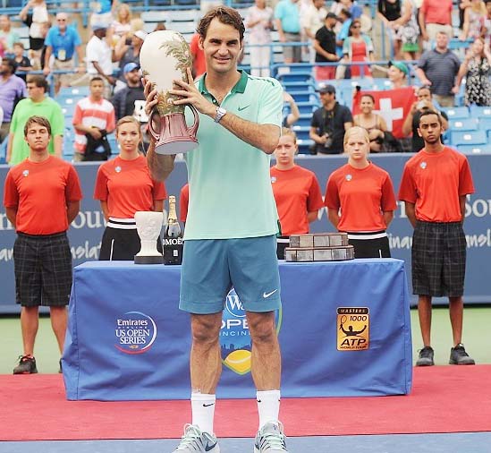 Roger Federer poses with the trophy after beating David Ferrer of Spain at the Cincinnati Masters on Sunday.