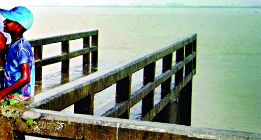 A big portion of the structure of 50 meter Baniajan spur built to protect Jamuna River embankment has been devoured by onrush of flood waters at Dhannot point in Bogra. This photo was taken on Monday.