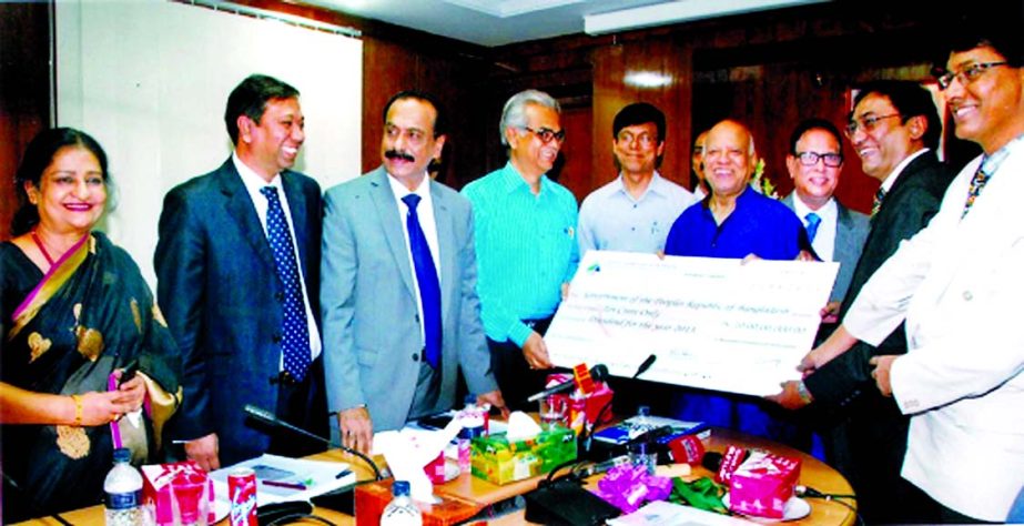 Finance Minister Abul Maal Abdul Muhith, receiving a cheque of Tk10 crore from Prof Santi Narayan Ghosh, Chairman and Md Zillur Rahman, Managing Director of Bangladesh Development Bank Limited as dividend at minister's Secretariat office on Tuesday.