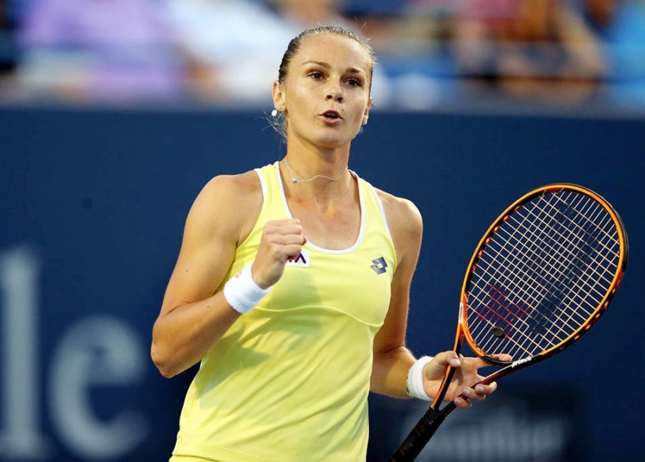 Magdalena Rybarikova of Slovakia celebrates her first set win over Simona Halep of Romania during the Connecticut Open tennis tournament in New Haven on Tuesday.