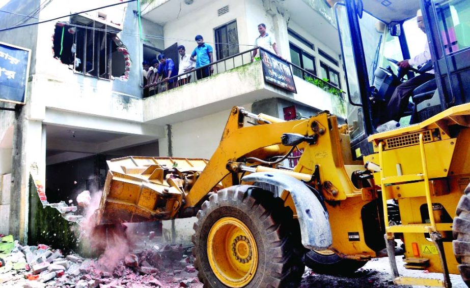 Unplanned structure at Topkhana Road in city was demolished by Rajuk on Wednesday.