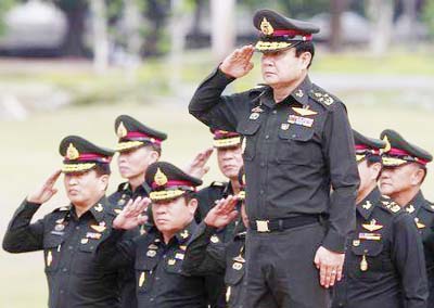Thailand's newly appointed Prime Minister Prayuth Chan-ocha (front) reviews honor guards during his visit at the 2nd Infantry Battalion, 21st Infantry Regiment, Queen's Guard in Chonburi province, on the outskirts of Bangkok.