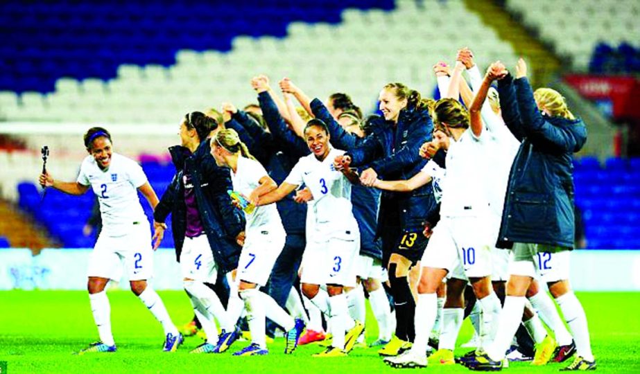 The England team celebrate after qualifying for the World Cup in Canada in 2015 beating Wales at the Cardiff City Stadium on Thursday.