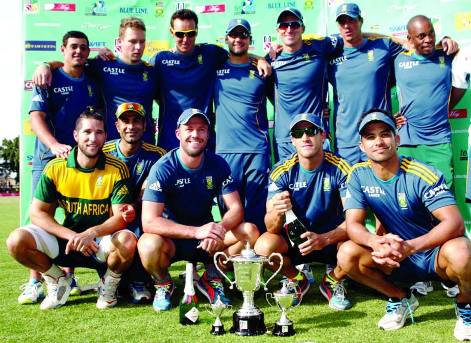 The South African players celebrate with the series trophy at Bulawayo on Thursday.