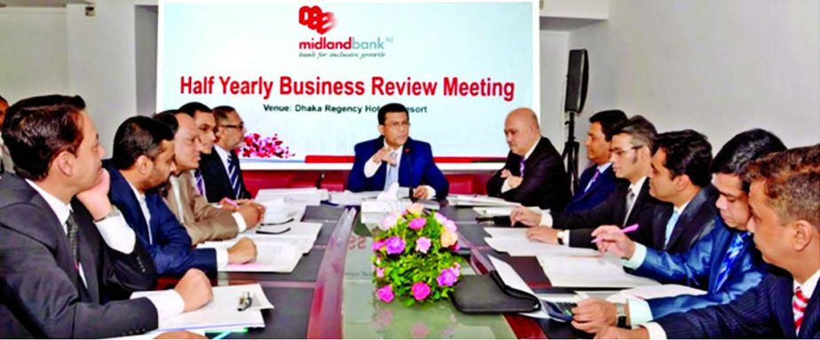 Md Ahsan-uz-Zaman, Managing Director of Midland Bank Limited, addressing a "Half Yearly Business Review Meeting" at a city hotel recently.