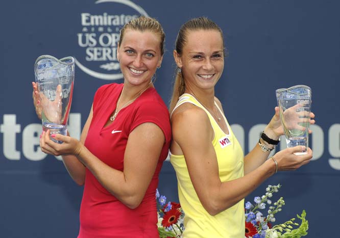 Petra Kvitova of the Czech Republic (left) and Magdalena Rybarikova of Slovakia celebrate after Kvitova's 6-4, 6-2 victory in the final match of the Connecticut Open tennis tournament in New Haven, Connecticut on Saturday.