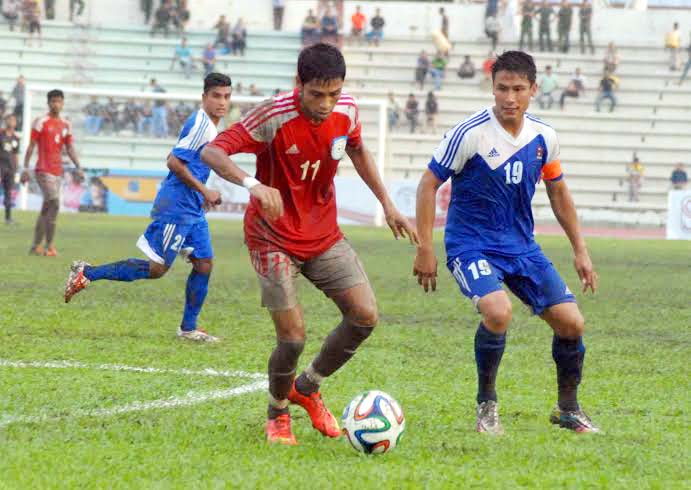 A moment of the International Friendly Football match between Bangladesh Under-23 National Football team and Nepal Under-23 National Football team at the Bangladesh Army Stadium in Banani on Tuesday.