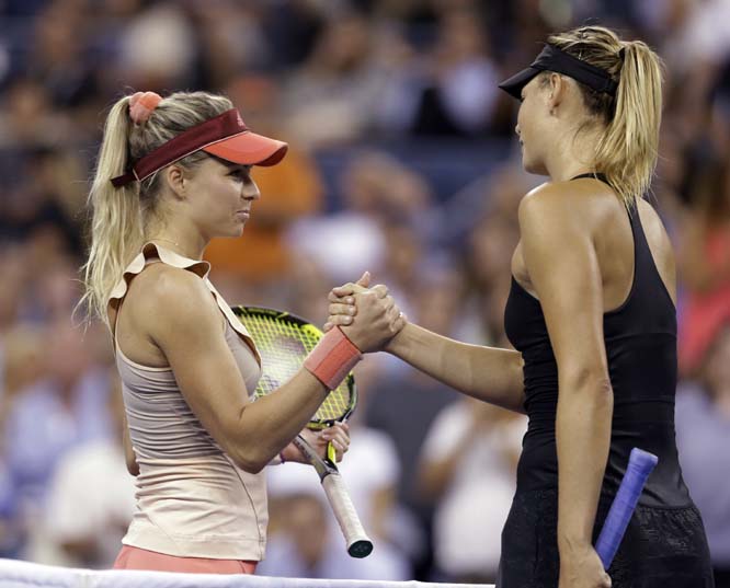 Maria Sharapova (right) of Russia is congratulated by Maria Kirilenko of Russia after Sharapova defeated Kirilenko 6-4, 6-0 in the opening round of the US Open tennis tournament in New York on Monday.