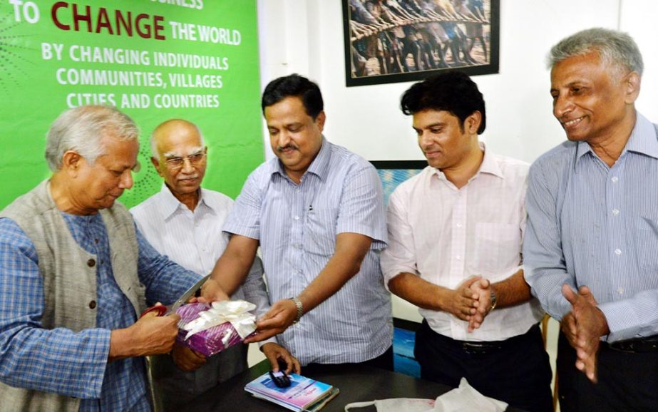 Nobel laureate Prof Dr Muhammad Yunus unwrapping cover of two books written by Adv A M Zia Habib Ahasan at a function at Chittagong on Tuesday.