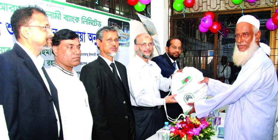 Badiur Rahman, Chairman of Al-Arafah Islami Bank Limited, inaugurating 'Hajj Booth 2014' for the pilgrims at Ashkona Hajj Camp in the city on Tuesday.