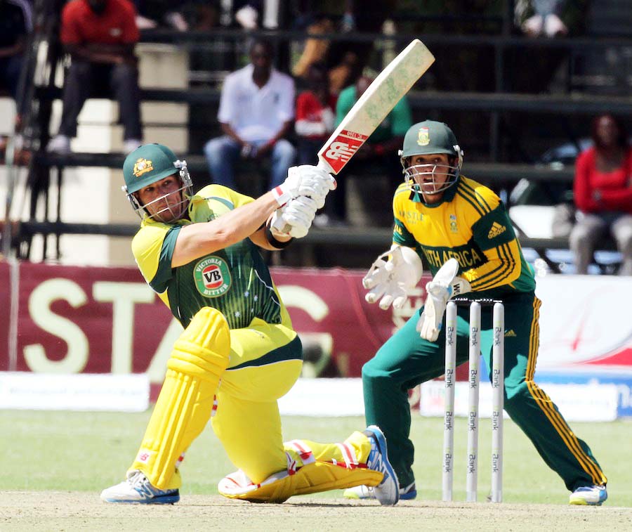Australian batsman Aaron Finch (left) plays a shot as South African wicketkeeper Quinton de Kock looks on during the ODI cricket match between South Africa and Australia in Harare, Zimbabwe on Wednesday. South Africa won by 7 wickets with 20 balls remaini