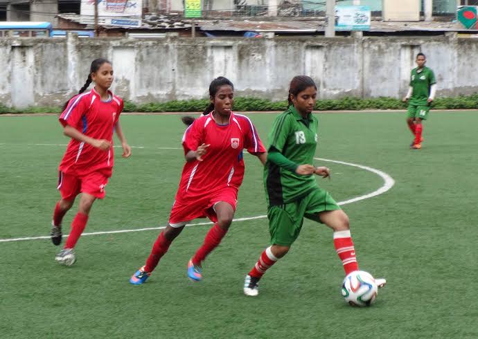 A scene from the practice football match between Bangladesh U-16 National Women's Football team and Narayanganj DFA Women's Football team at the BFF Artificial Turf on Wednesday. Bangladesh U-16 National Women's Football team won the match 2-0.