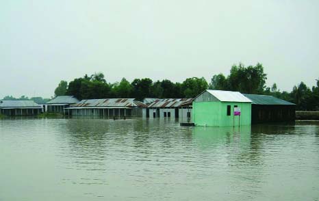 JAMALPUR: Many dwelling houses still under flood water at Islampur upazila in Jamalpur district. This picture was taken yesterday.