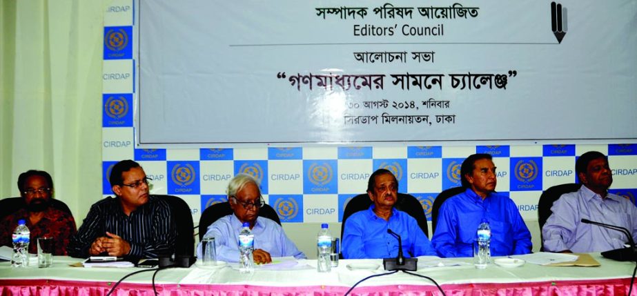 President of Editors' Council Golam Sarwar along with other distinguished persons at a discussion on 'Challenge before mass media' organized by the council at CIRDAP Auditorium in the city on Saturday.