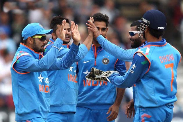 Suresh Raina celebrates with his team-mates after taking the wicket of Alex Hales in his first over during the 3rd ODI between India and England at Nottingham on Saturday.