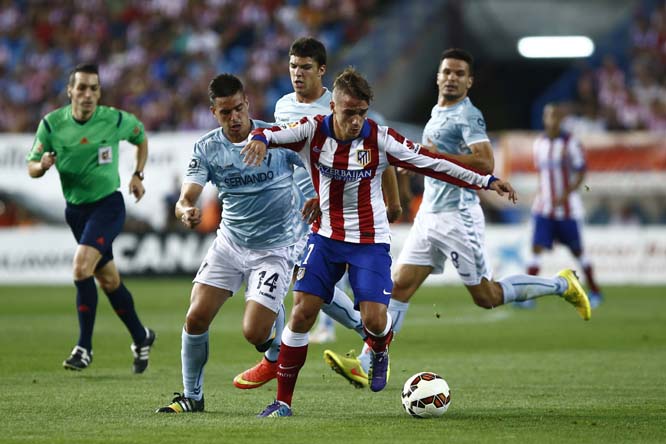 Atletico's Antoine Griezmann (centre right) in action with Eibar's Dani Garcia (left) during a Spanish La Liga soccer match between Atletico de Madrid and Eibar at the Vicente Calderon stadium in Madrid Spain on Saturday.