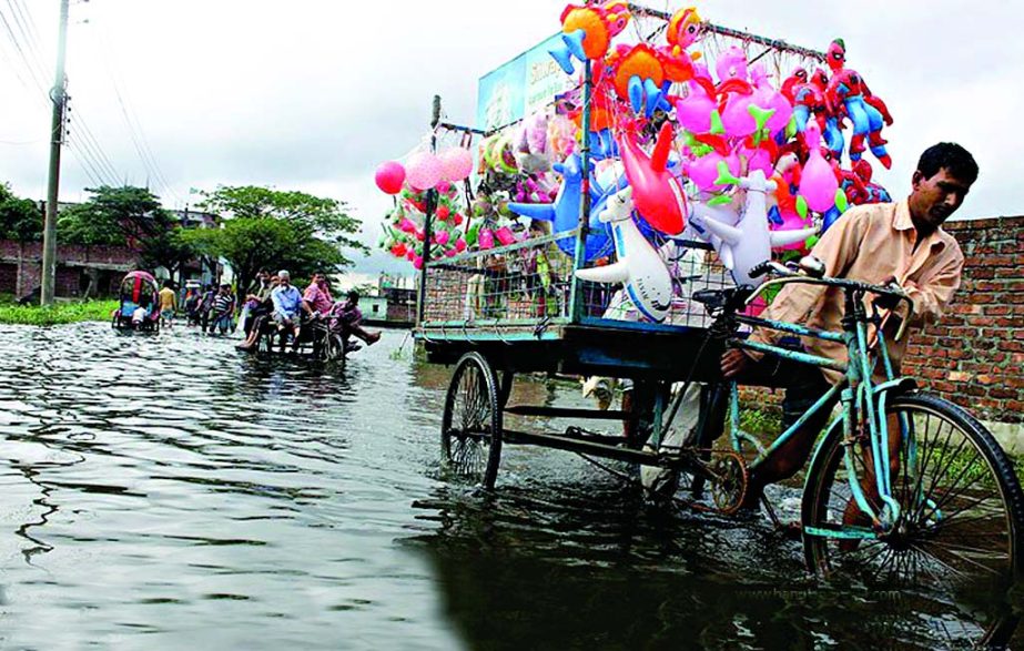 Stagnant rain waters along with piles of garbage at city's Matuail created serious pollution problem for the people of entire area. This photo was taken on Sunday.